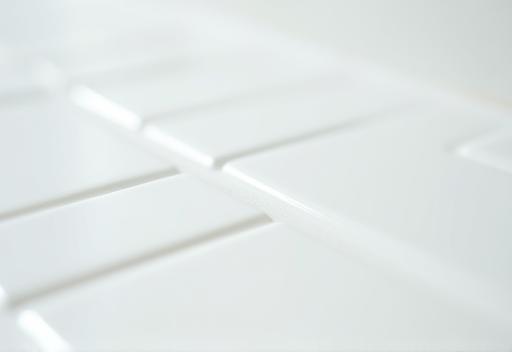Close-up image of detailed cleaning on bathroom tile grout